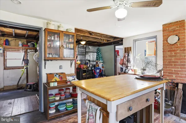 a view of a play room with furniture and a window