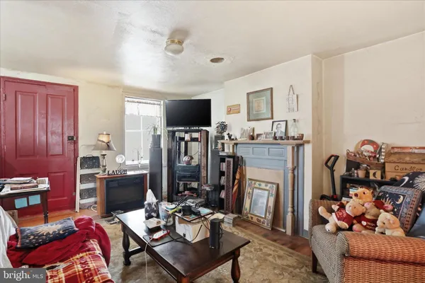 a view of a livingroom with furniture and a flat screen tv