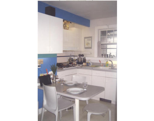59 Withington Road Newton, MA 02460 - Photo 4 of 11 a kitchen with a sink and chairs