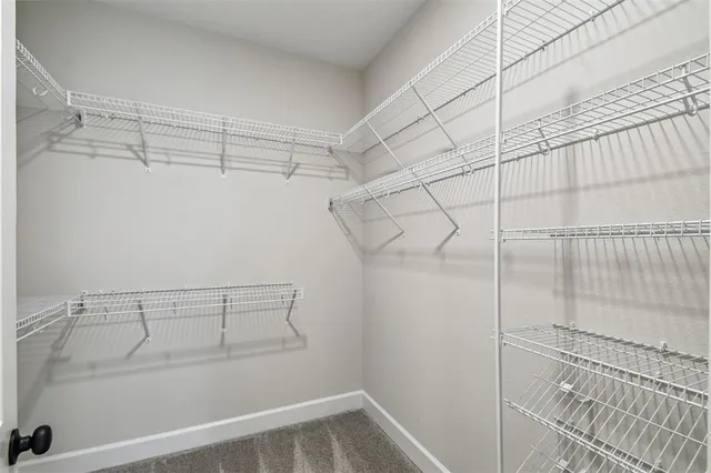 a bathroom with a white bath tub a shower and a sink