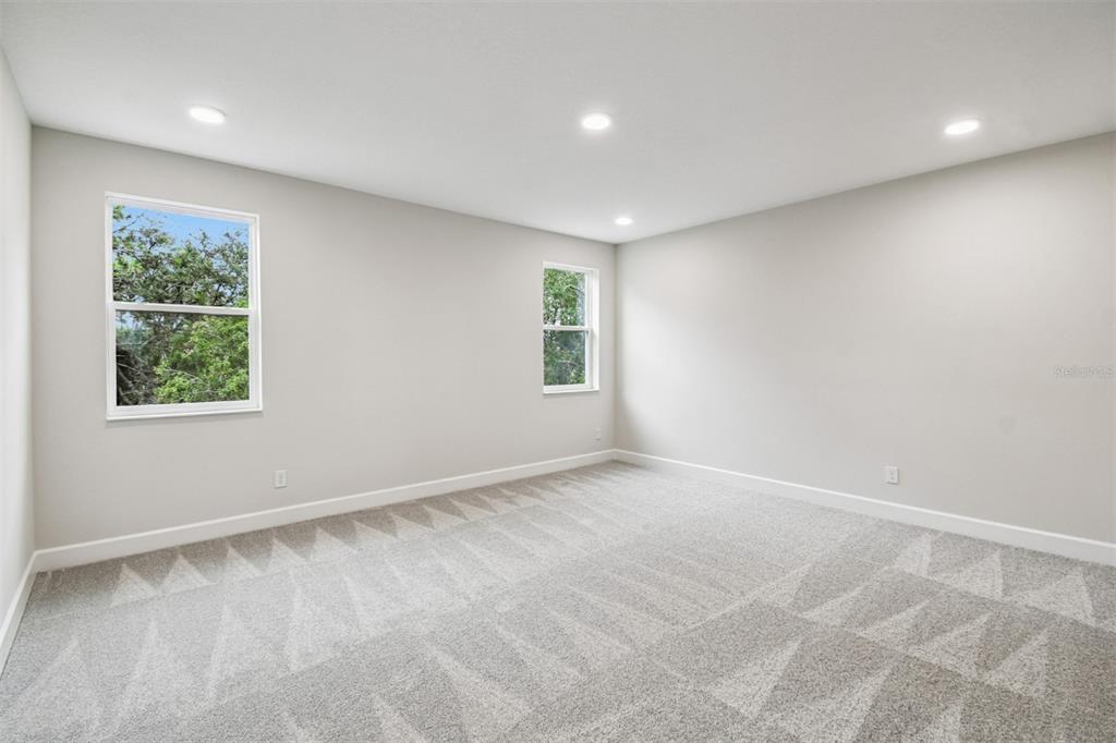 5262 Prairie Preserve Run St. Cloud, FL 34772 - Photo 17 of 40 an empty room with windows