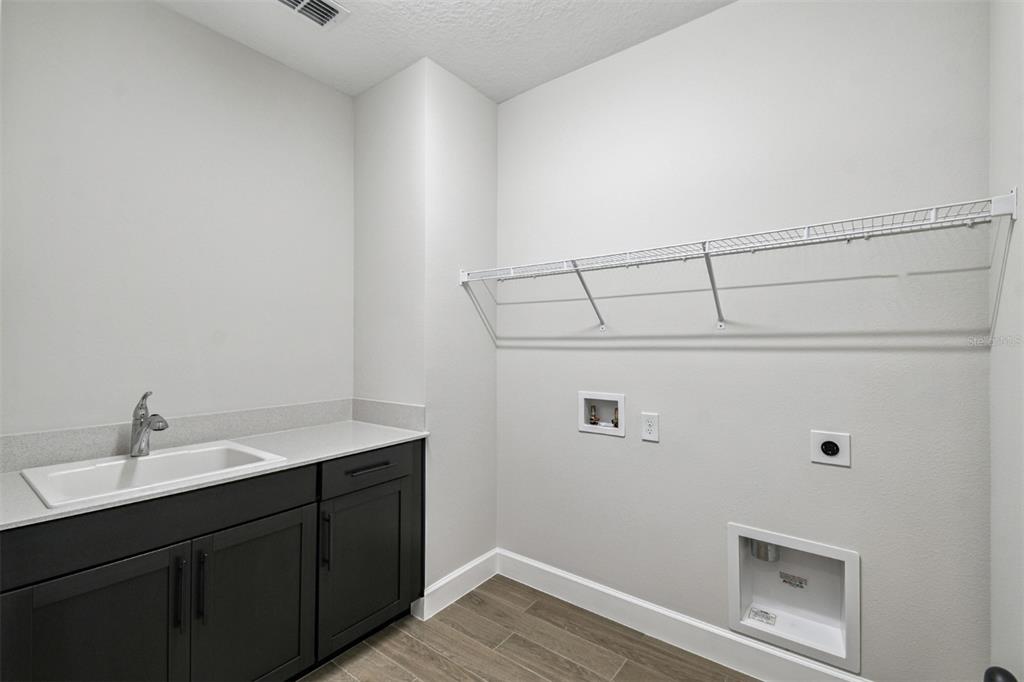 5262 Prairie Preserve Run St. Cloud, FL 34772 - Photo 18 of 40 a bathroom with a sink and a mirror