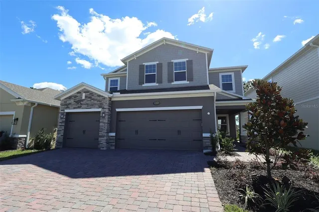 a front view of a house with a garage
