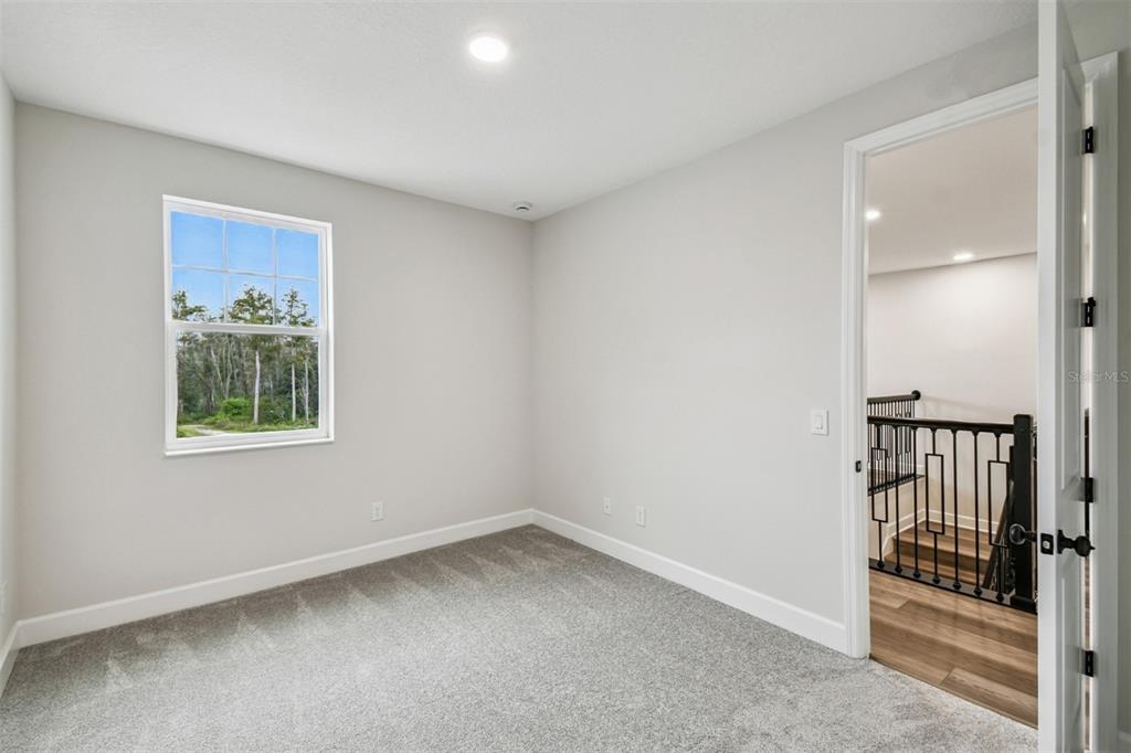 5262 Prairie Preserve Run St. Cloud, FL 34772 - Photo 21 of 40 wooden floor in an empty room