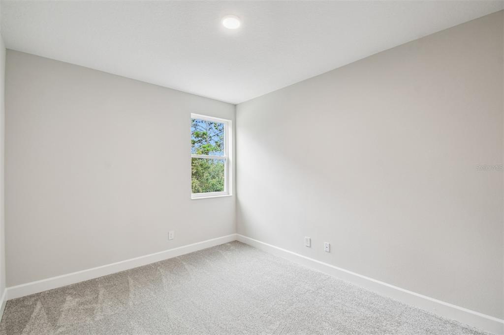 5262 Prairie Preserve Run St. Cloud, FL 34772 - Photo 26 of 40 an empty room with a window