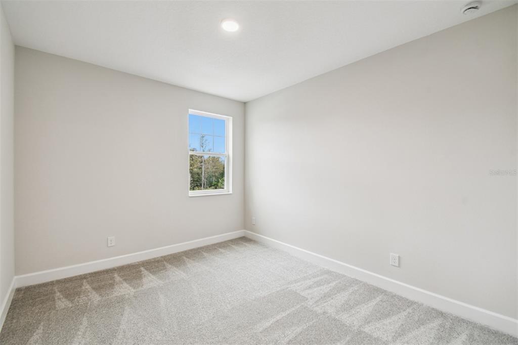 5262 Prairie Preserve Run St. Cloud, FL 34772 - Photo 29 of 40 a view of an empty room with a window