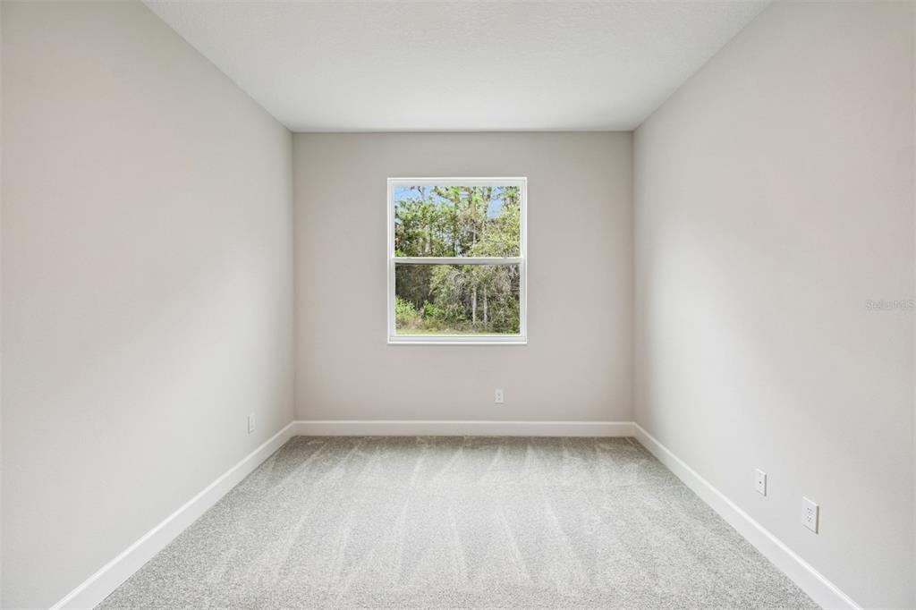 5262 Prairie Preserve Run St. Cloud, FL 34772 - Photo 30 of 40 an empty room with a window