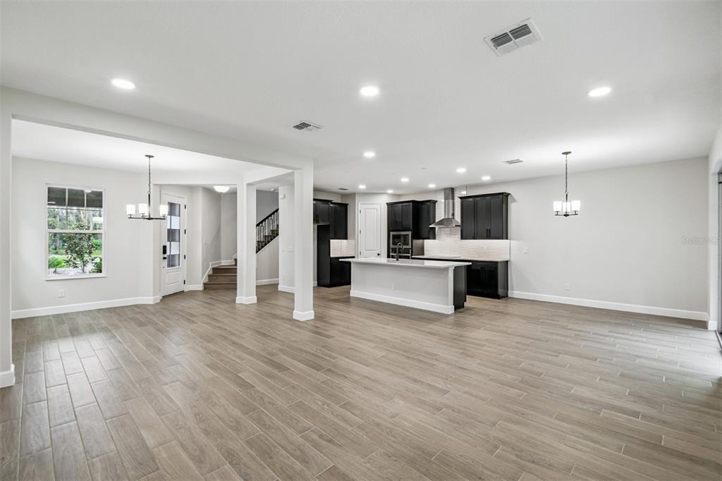 5262 Prairie Preserve Run St. Cloud, FL 34772 - Photo 33 of 40 a view of kitchen with white cabinets and refrigerator