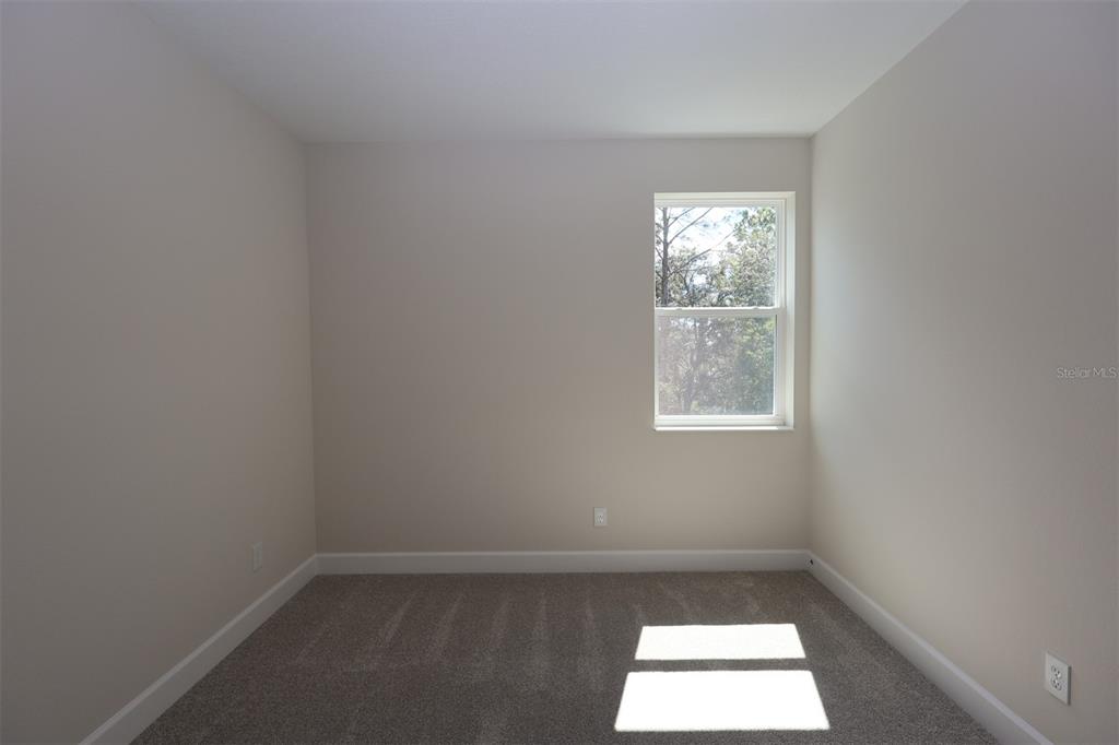 5262 Prairie Preserve Run St. Cloud, FL 34772 - Photo 7 of 40 an empty room with a window