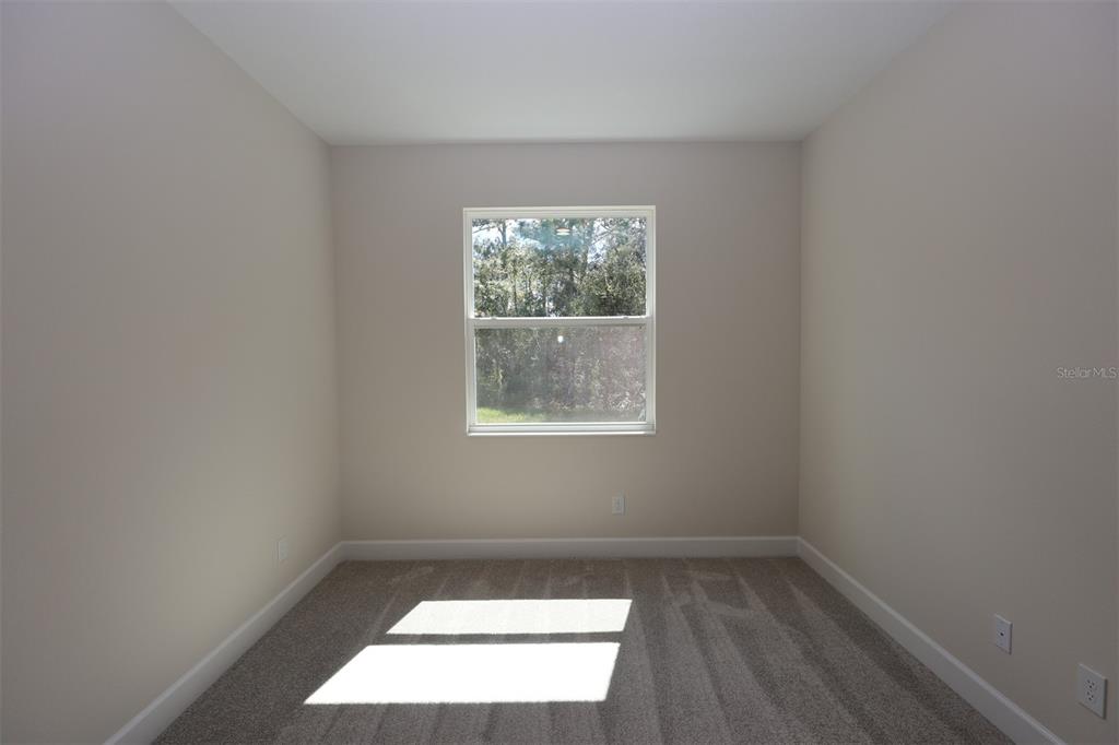 5262 Prairie Preserve Run St. Cloud, FL 34772 - Photo 10 of 40 an empty room with a window