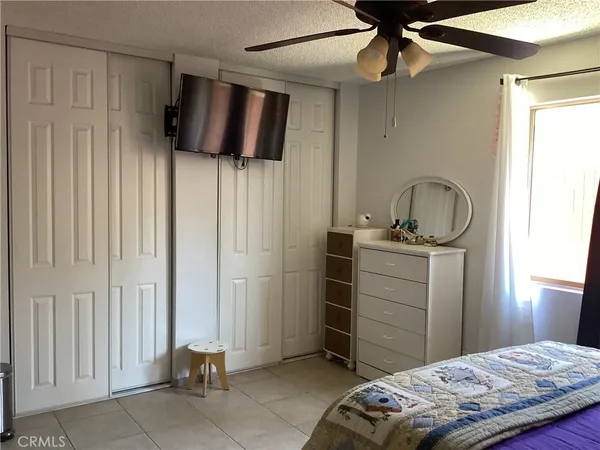 a bedroom with a bed and a bathroom