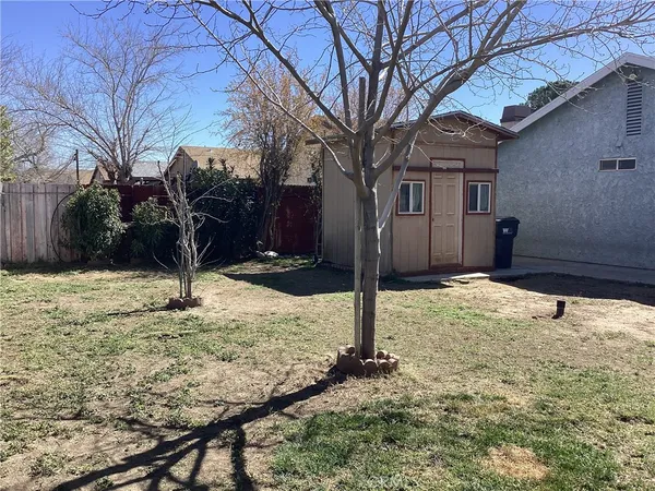 a house with trees in the background