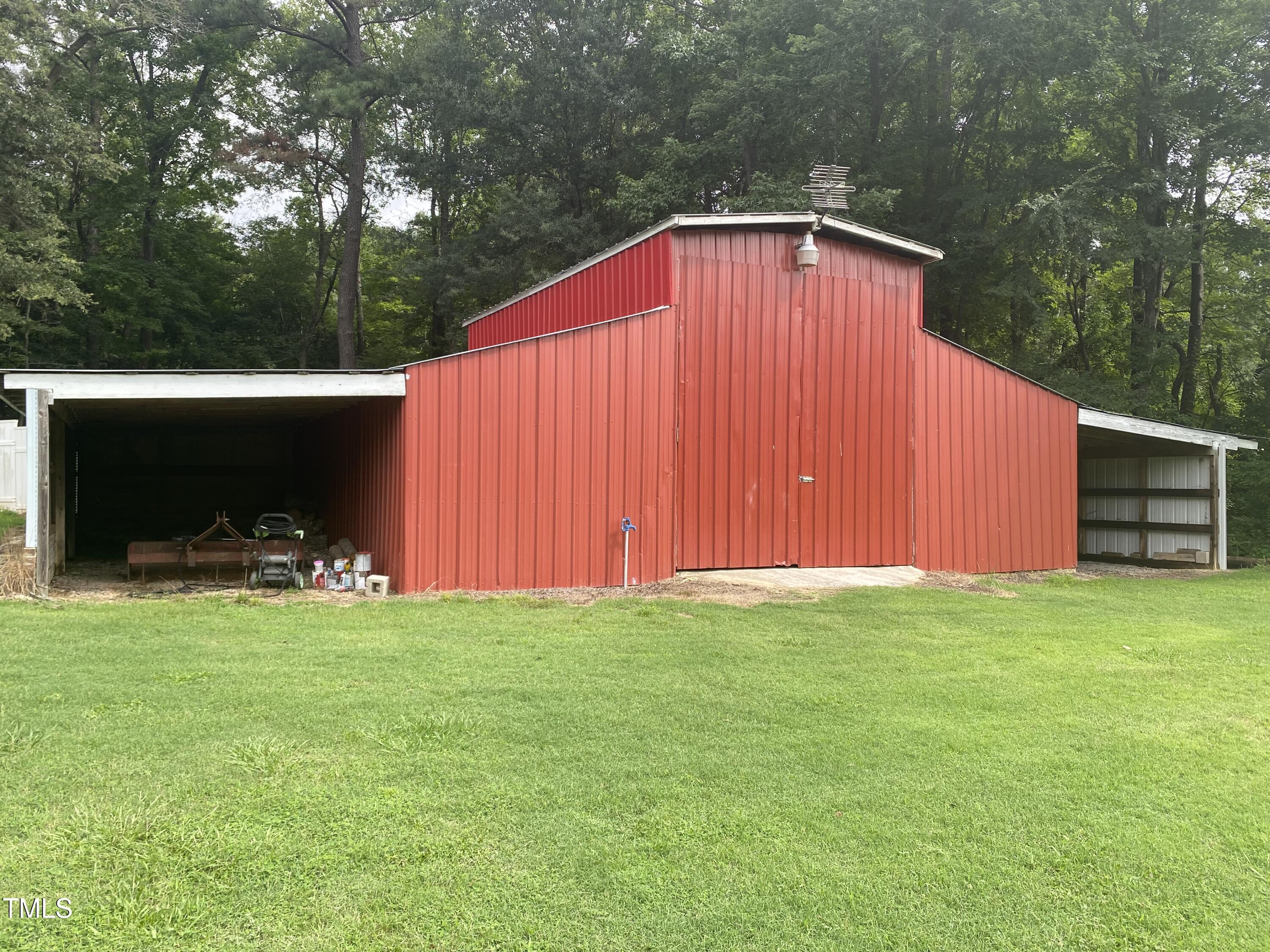 920 Vanco Mill Road Henderson, NC 27537 - Photo 11 of 26 a view of a backyard with sitting area