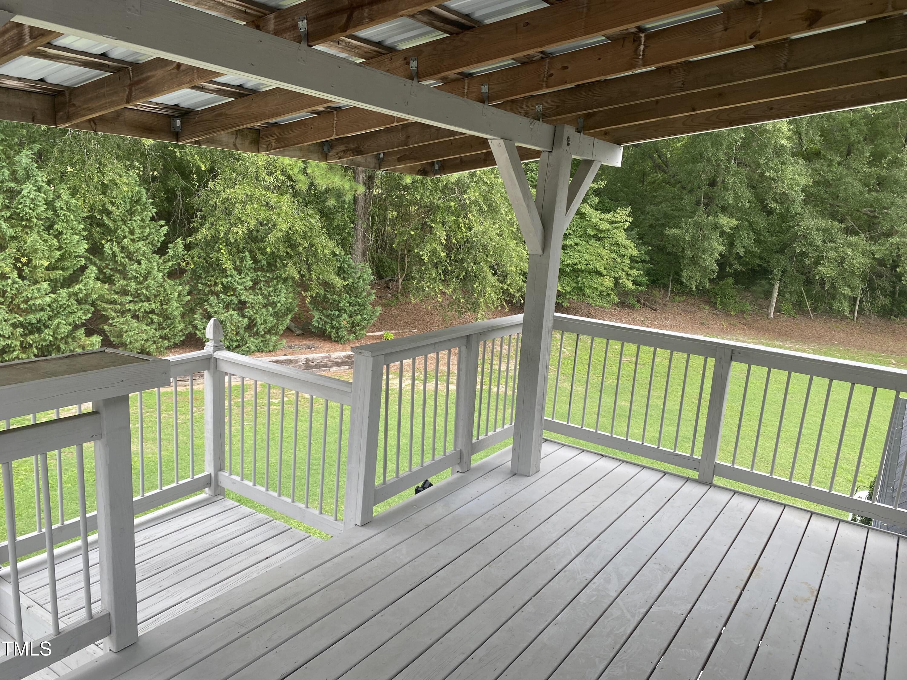 920 Vanco Mill Road Henderson, NC 27537 - Photo 17 of 26 a view of a wooden deck