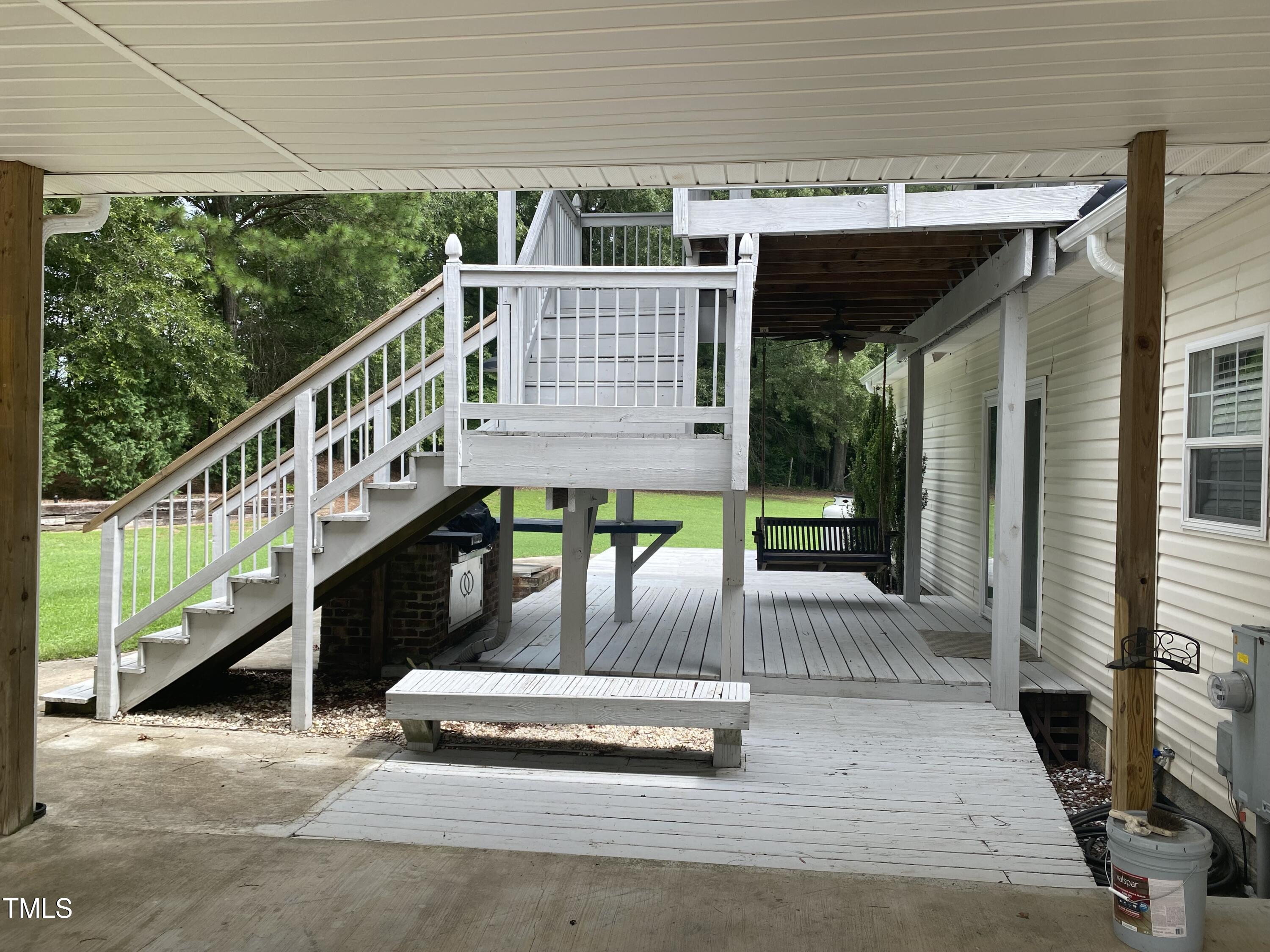 920 Vanco Mill Road Henderson, NC 27537 - Photo 20 of 26 a view of a patio with wooden floor and iron stairs