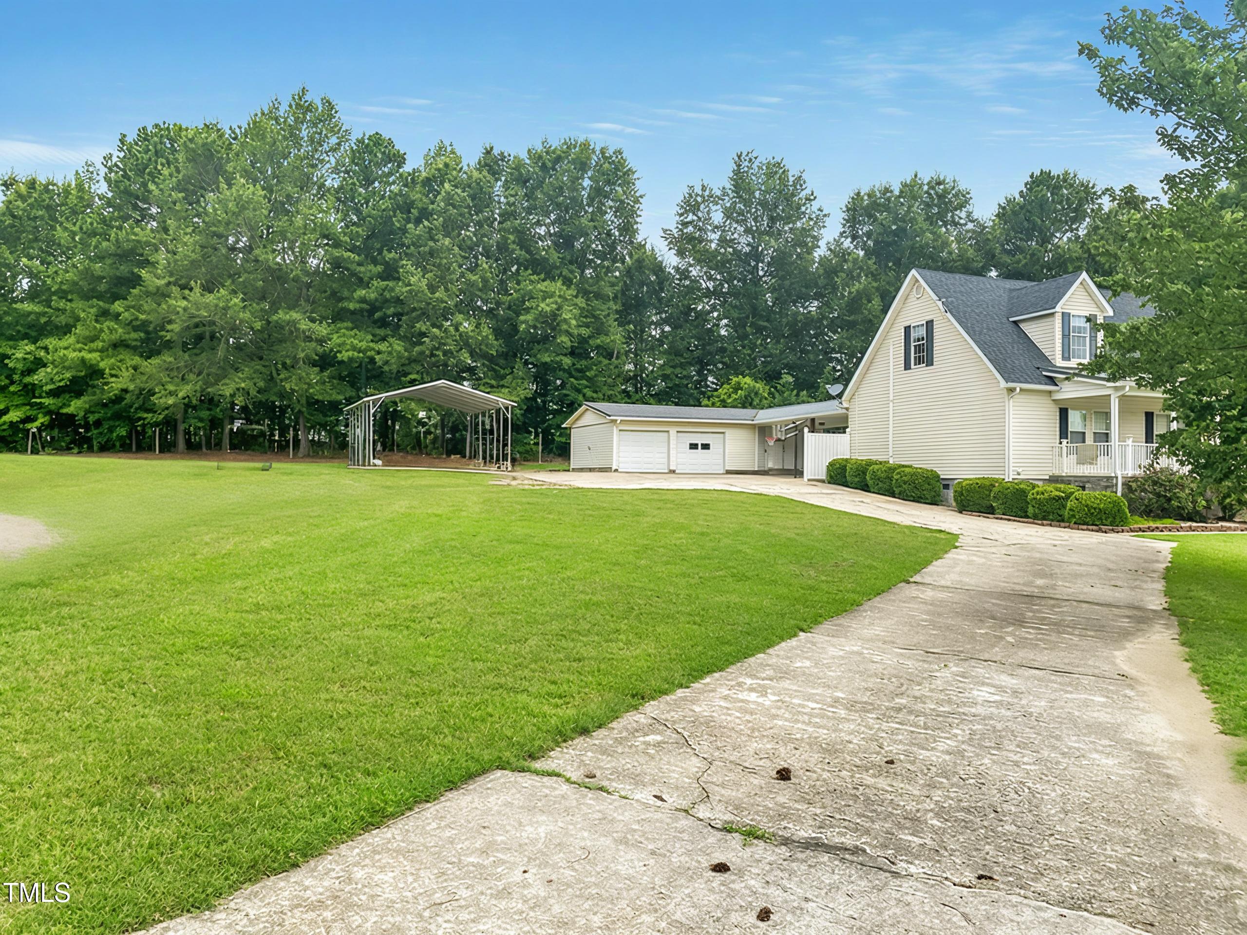 920 Vanco Mill Road Henderson, NC 27537 - Photo 2 of 26 a view of house with a big yard