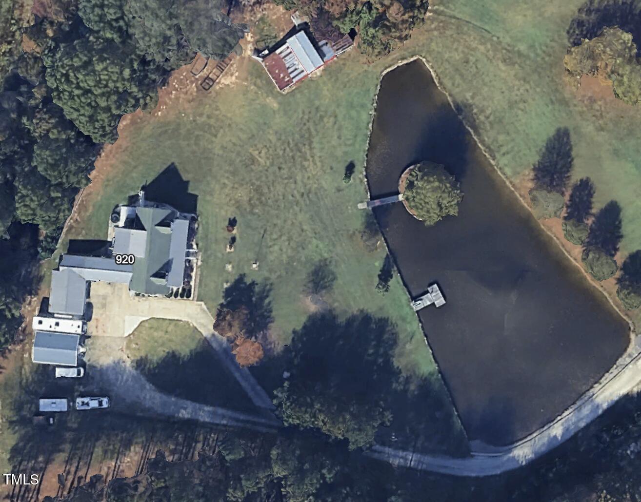 920 Vanco Mill Road Henderson, NC 27537 - Photo 26 of 26 an aerial view of a house with a yard