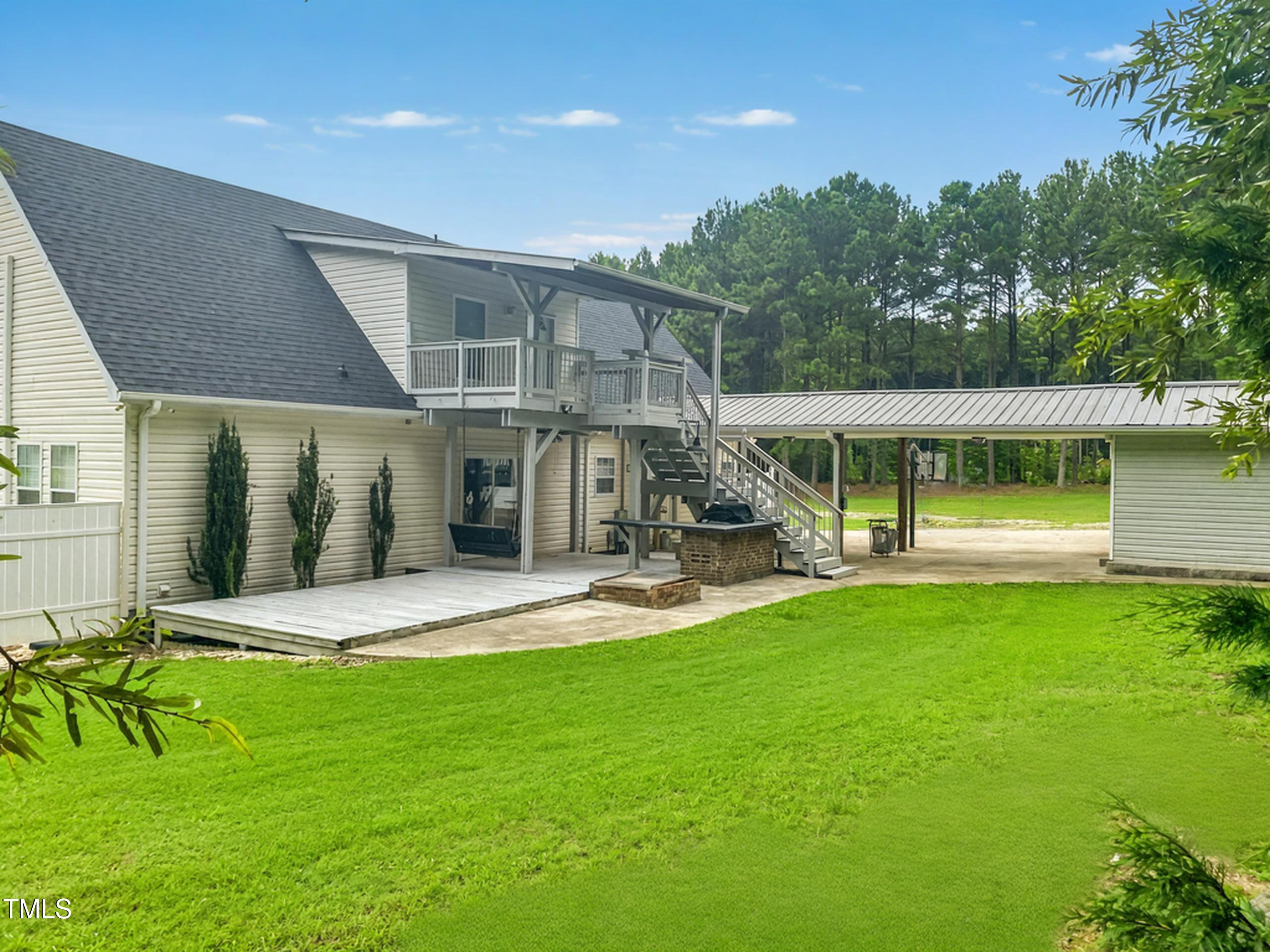920 Vanco Mill Road Henderson, NC 27537 - Photo 3 of 26 a view of a house with a yard porch and sitting area