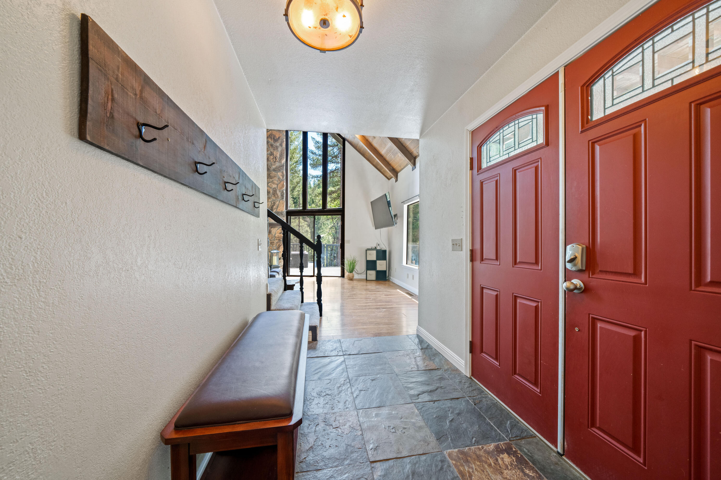 19610 Roaring Brook Way Lakehead, CA 96051 - Photo 11 of 58 a view of a hallway with wooden floor and staircase