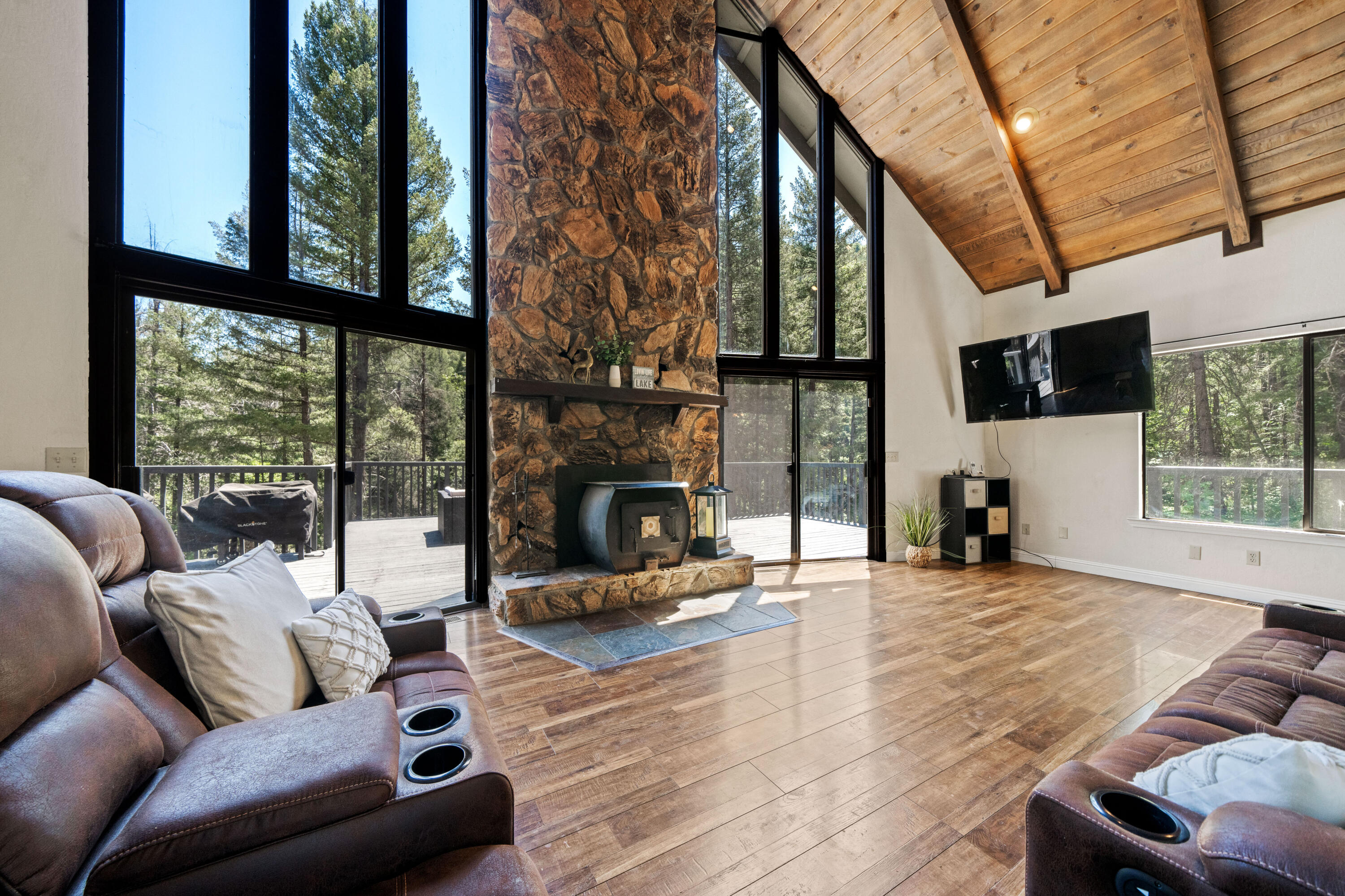 19610 Roaring Brook Way Lakehead, CA 96051 - Photo 2 of 58 a living room with furniture a fireplace and a flat screen tv