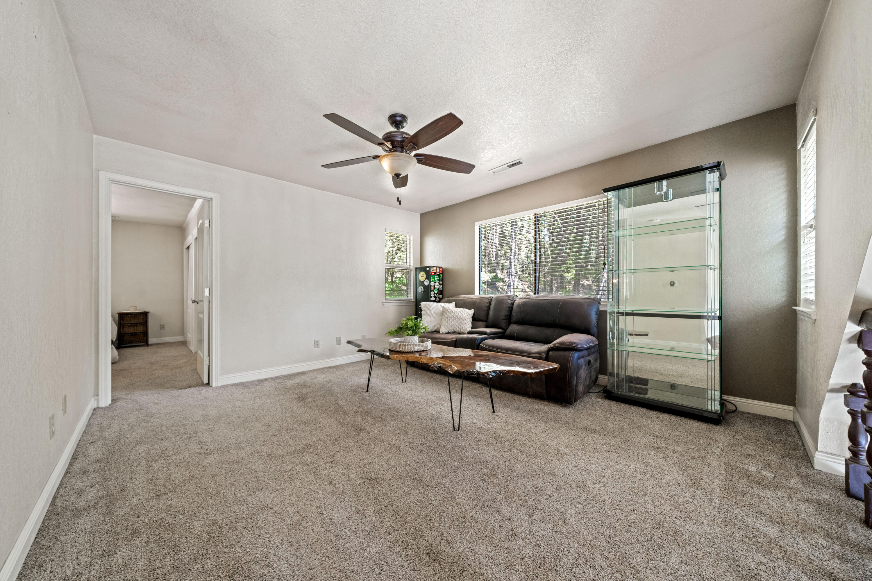 19610 Roaring Brook Way Lakehead, CA 96051 - Photo 30 of 58 a living room with furniture and a ceiling fan