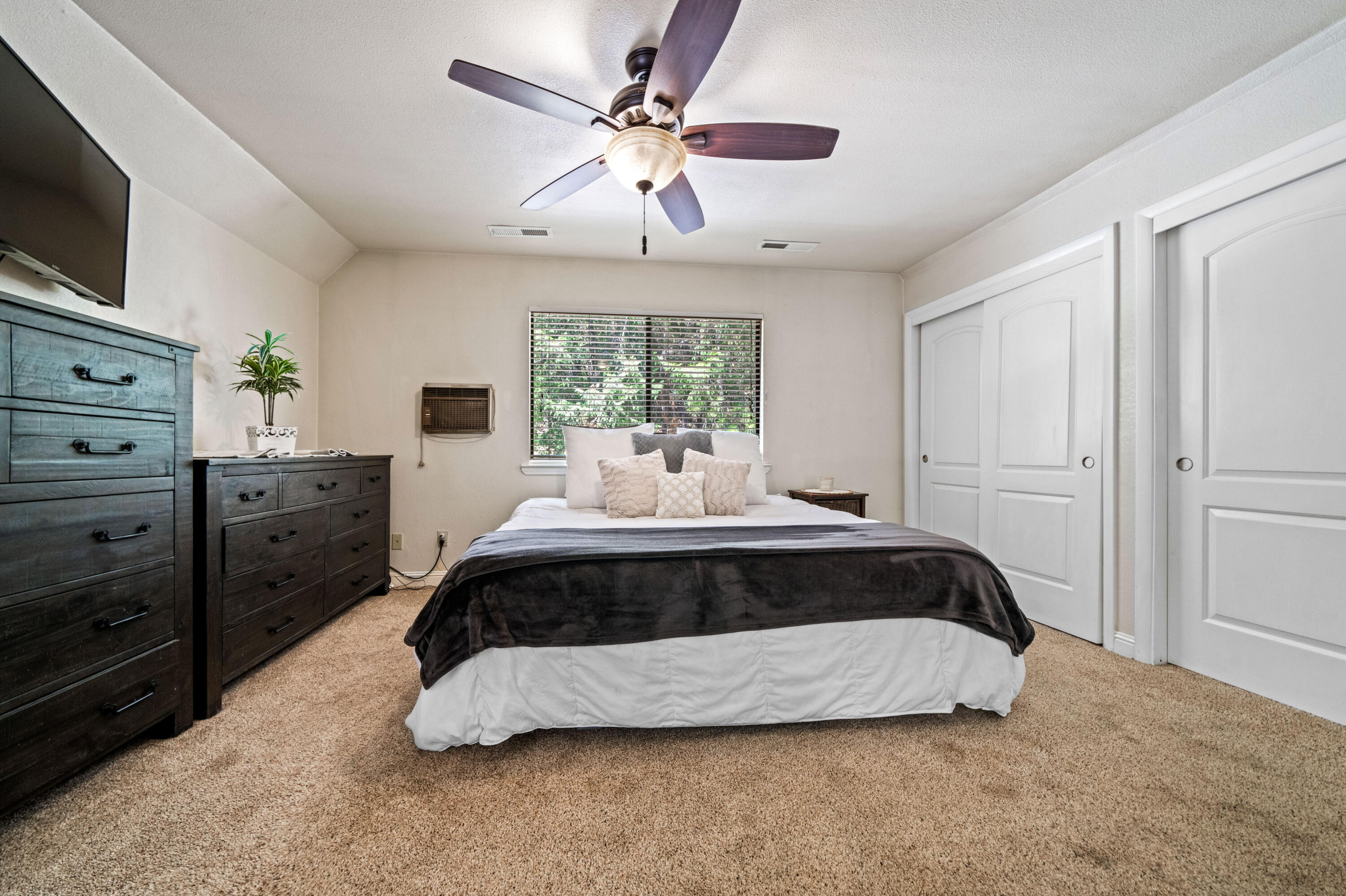 19610 Roaring Brook Way Lakehead, CA 96051 - Photo 32 of 58 a spacious bedroom with a bed and window