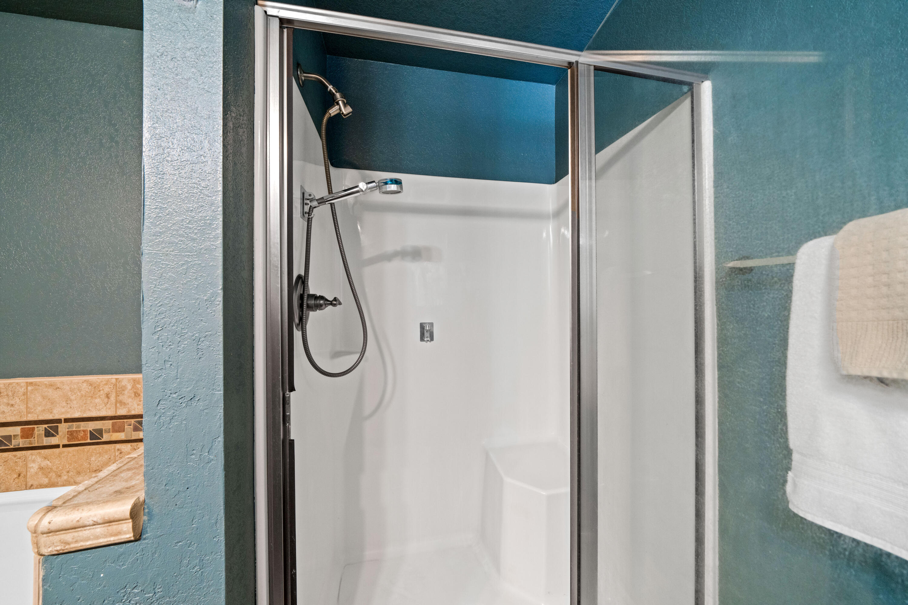 19610 Roaring Brook Way Lakehead, CA 96051 - Photo 38 of 58 a bathroom with a glass shower door