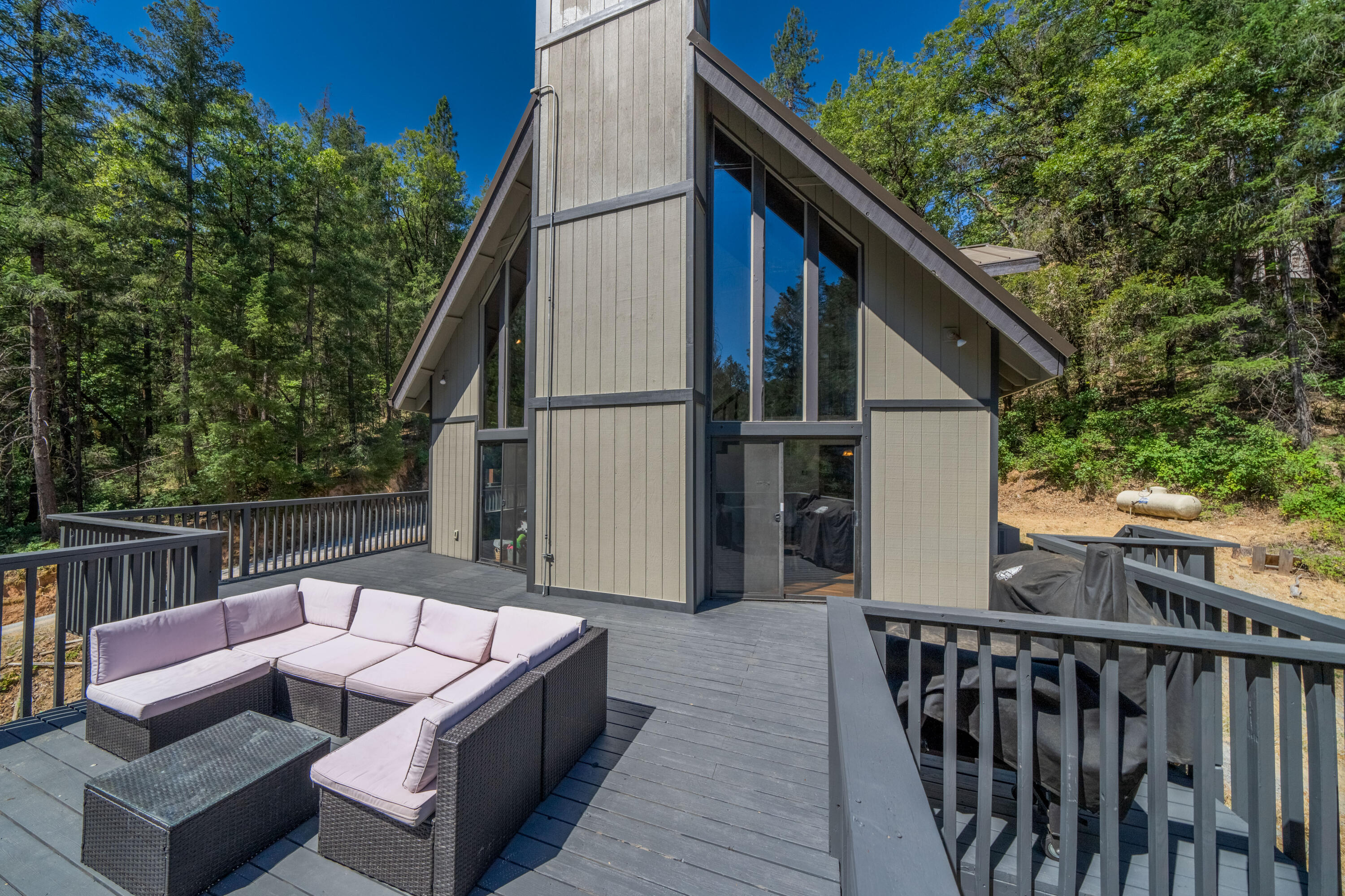 19610 Roaring Brook Way Lakehead, CA 96051 - Photo 41 of 58 a view of roof deck with couches and wooden fence