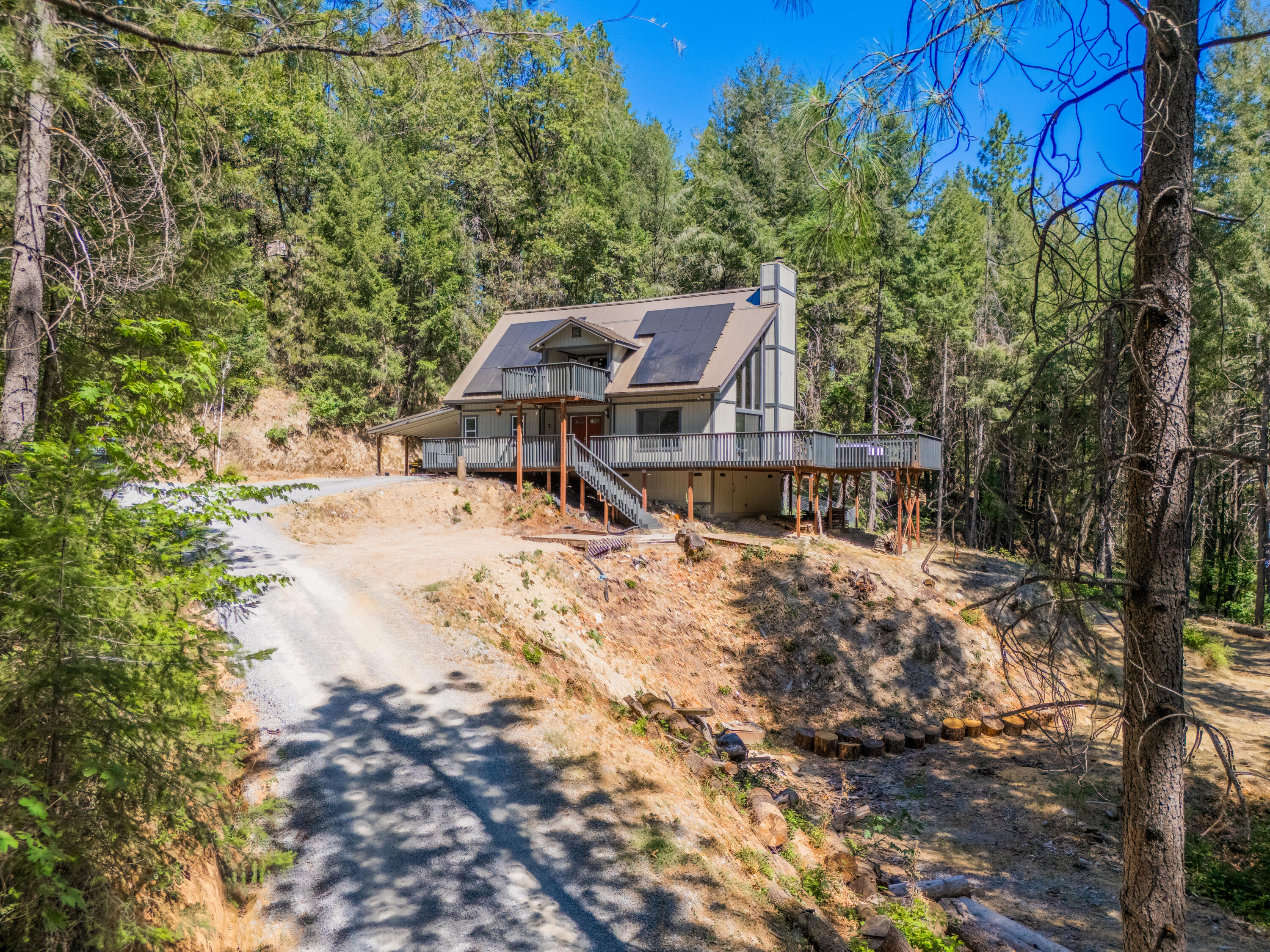 19610 Roaring Brook Way Lakehead, CA 96051 - Photo 48 of 58 a view of a house with a yard