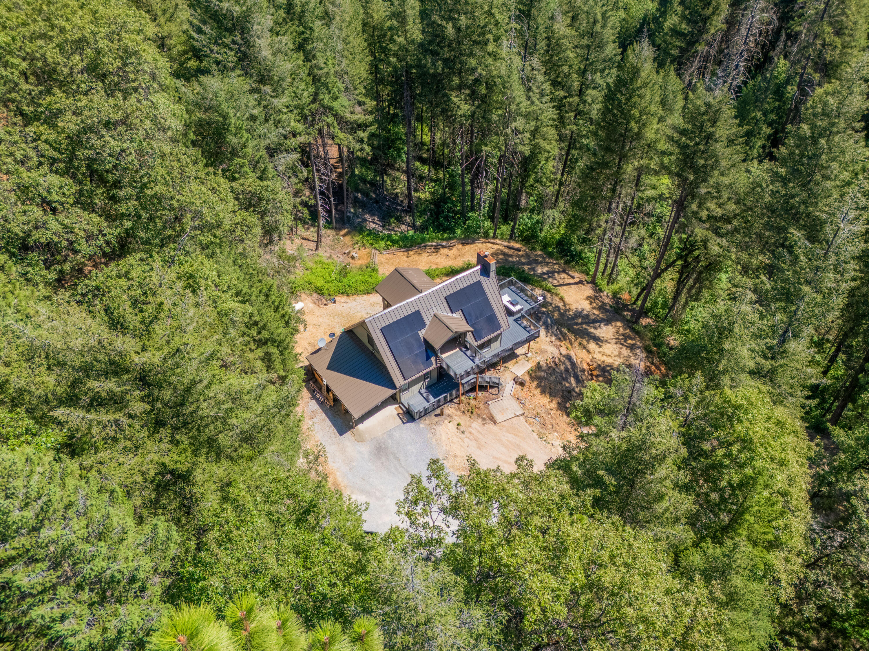 19610 Roaring Brook Way Lakehead, CA 96051 - Photo 52 of 58 an aerial view of a house with a yard and lake view