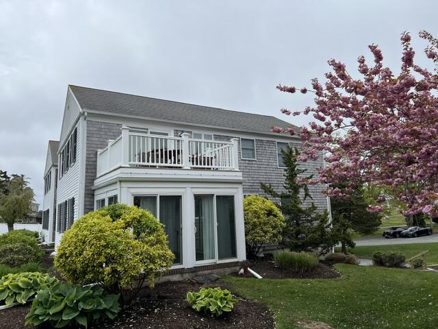99 Depot Road, Unit 23 Chatham, MA 02633 - Photo 3 of 4 front view of a house with a yard
