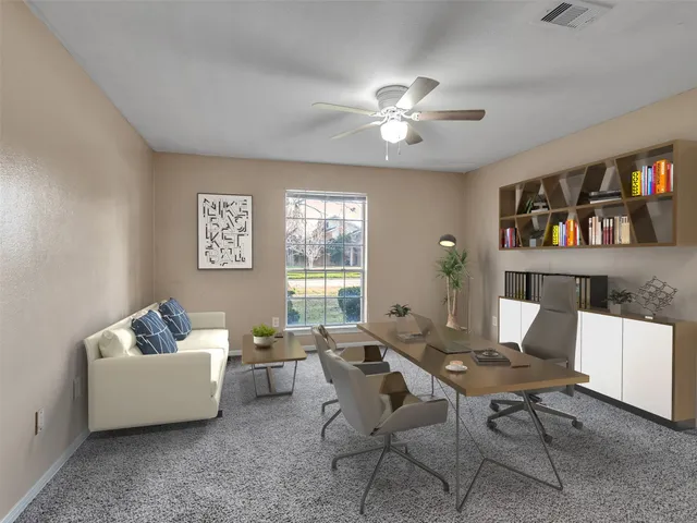 a living room with furniture and a window