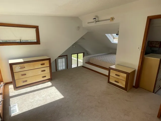 a view of room with furniture and a window