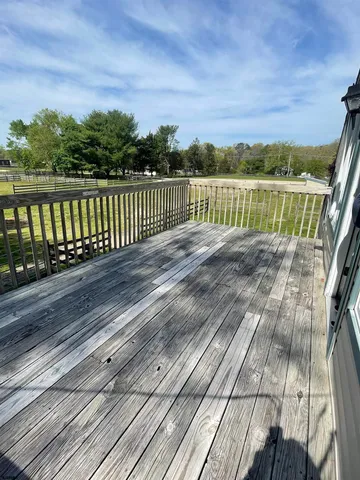 a view of wooden floor with a lake view