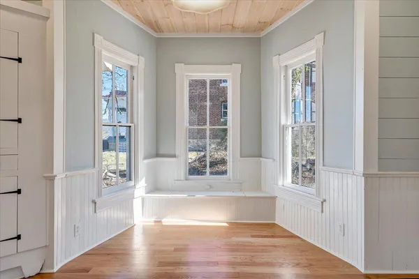 a bathroom with a toilet a sink and a mirror