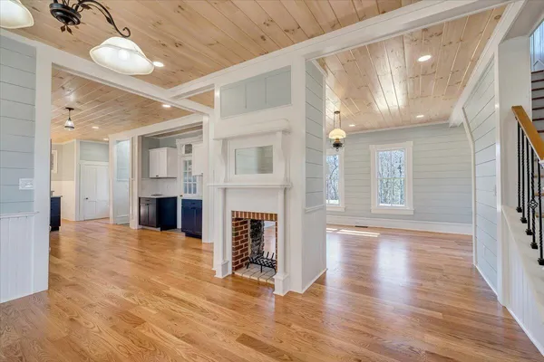 a view of entryway with wooden floor and stairs