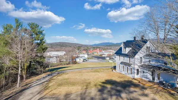 a view of a balcony with wooden floor