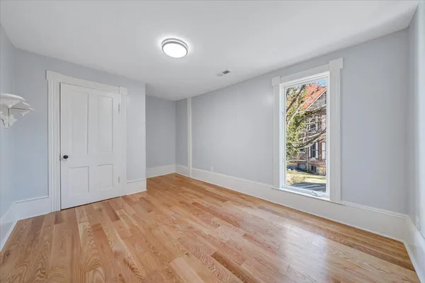 a view of a porch with wooden floor