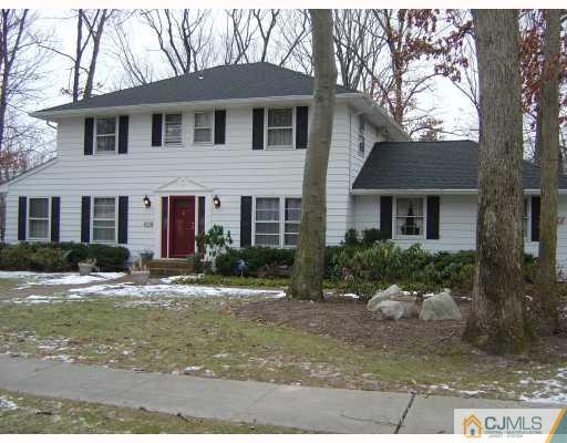 276 Hamlin Road North Brunswick, NJ 08902 - Photo 1 of 10 a front view of a house with a yard