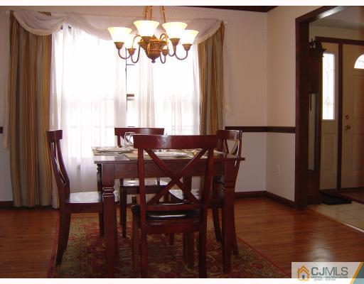 276 Hamlin Road North Brunswick, NJ 08902 - Photo 3 of 10 a view of a dining room with furniture window and wooden floor
