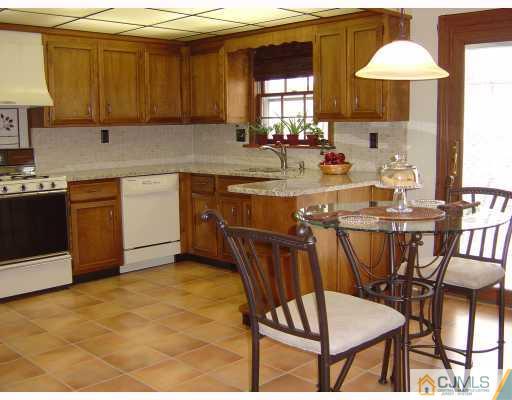276 Hamlin Road North Brunswick, NJ 08902 - Photo 4 of 10 a kitchen with a sink cabinets and window
