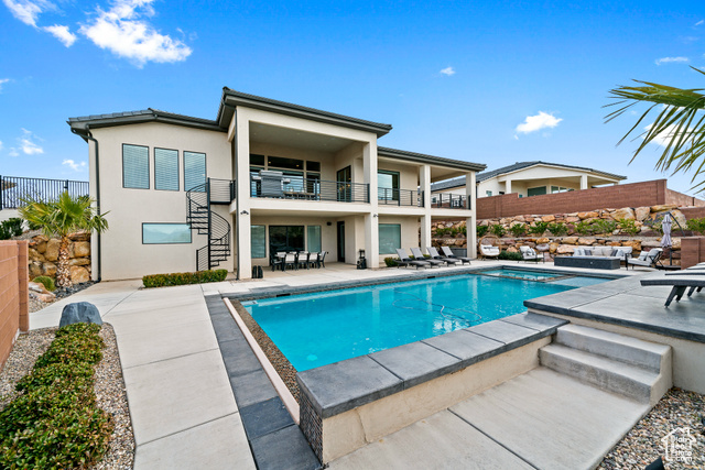 6026 Zen Trail Way St. George, UT 84790 - Photo 2 of 41 Rear view of house featuring stairway, stucco siding, a balcony, and a patio area