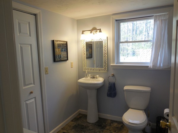 16 Leno Road Holland, MA 01521 - Photo 17 of 30 a bathroom with a toilet sink and mirror