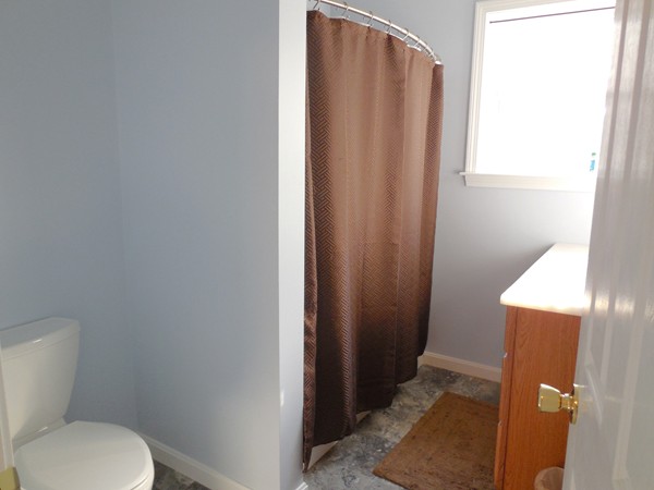 16 Leno Road Holland, MA 01521 - Photo 22 of 30 a bathroom with a toilet and a shower curtain
