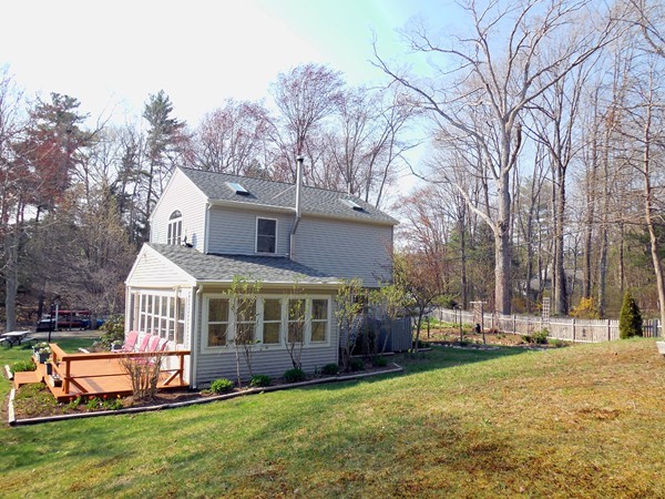 16 Leno Road Holland, MA 01521 - Photo 28 of 30 a front view of a house with a yard table and chairs