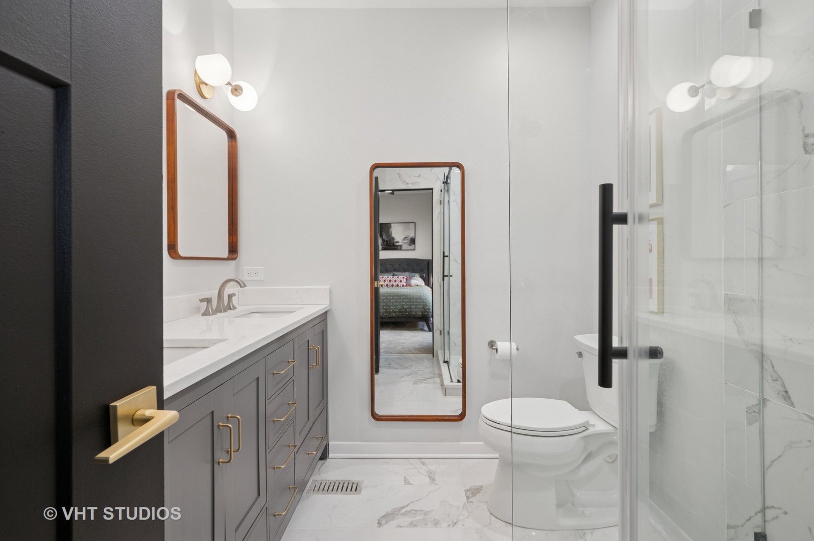 845 West Grace Street, Unit 2W Chicago, IL 60613 - Photo 12 of 21 a bathroom with a granite countertop toilet sink and mirror