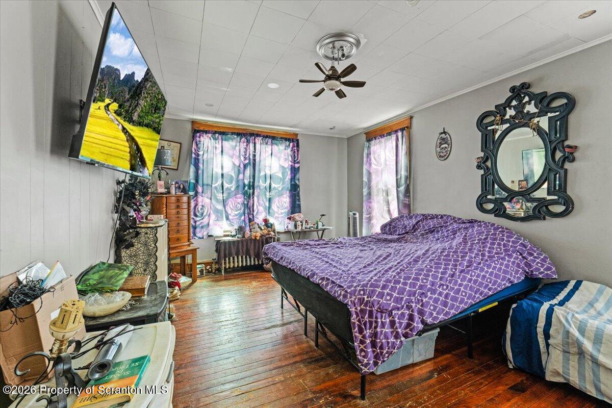 622 East Market Street Scranton, PA 18509 - Photo 13 of 44 a bed room with a bed mirror and a window