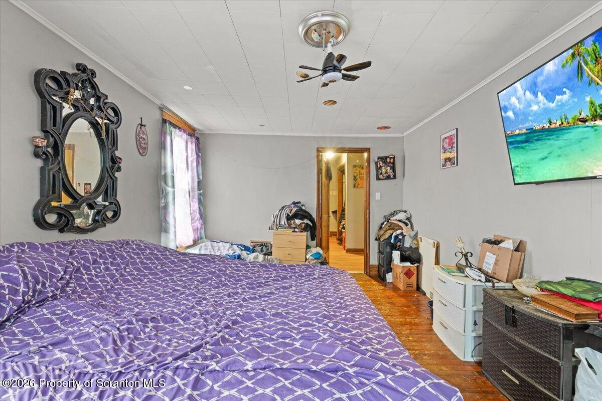622 East Market Street Scranton, PA 18509 - Photo 14 of 44 a bed room with a bed and a tv