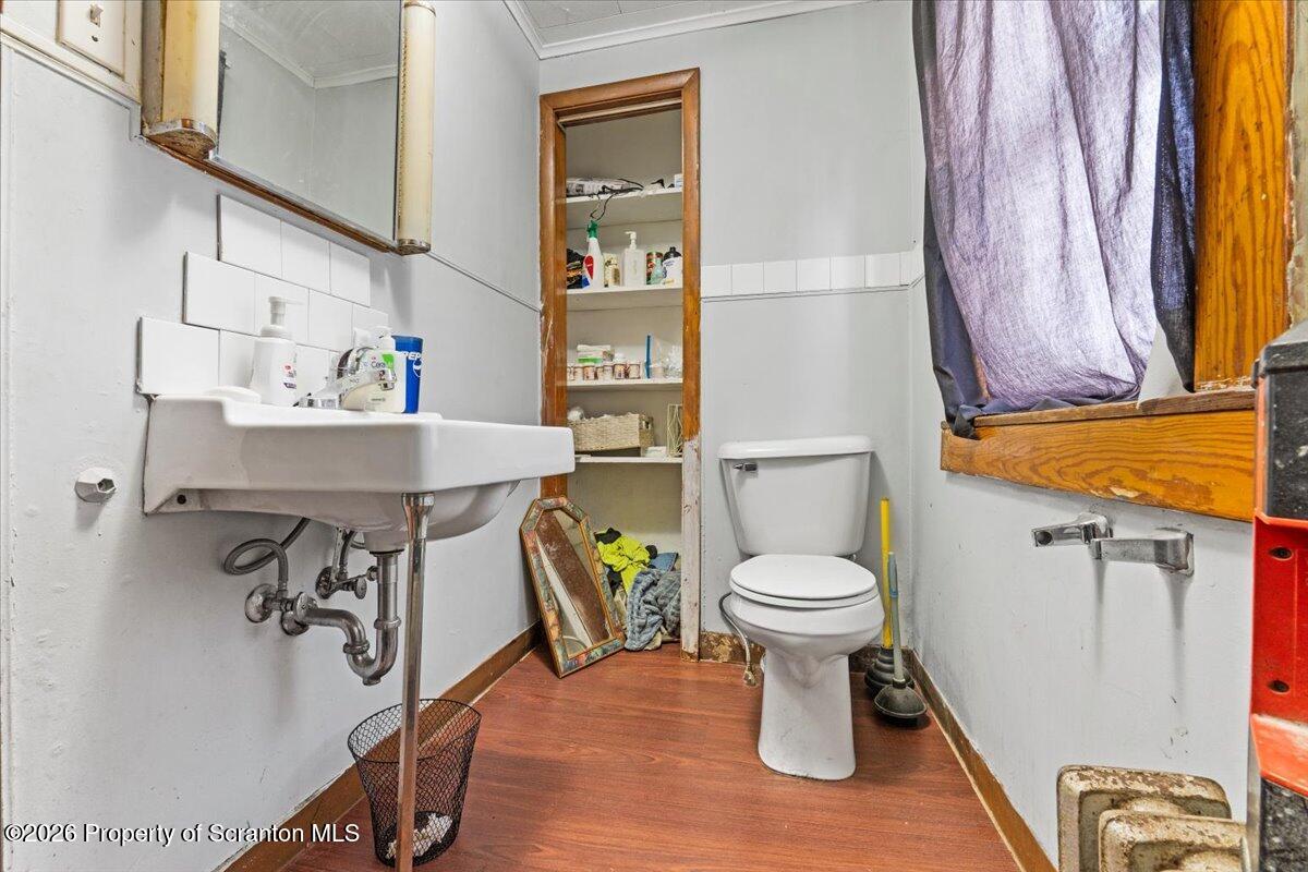 622 East Market Street Scranton, PA 18509 - Photo 16 of 44 a bathroom with a sink toilet and a mirror
