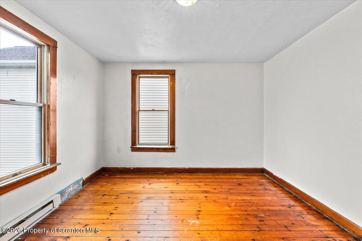 622 East Market Street Scranton, PA 18509 - Photo 24 of 44 a view of an empty room with wooden floor and a window